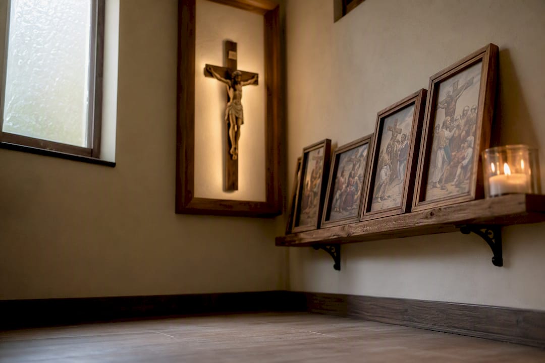 Home prayer corner with crucifix and Stations of the Cross prints