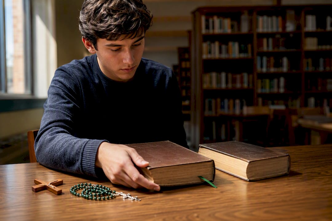 Person discerning between two saint biographies